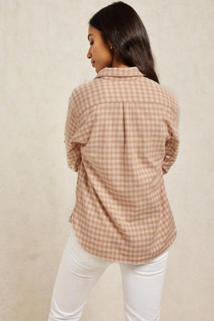 Soft brushed pale pink and light brown cotton gingham check women’s shirt. With centre back box pleat and curved hem for extra ease. Cut from brushed cotton to a boyfriend fit. Casual wear. Size XS, S, M, L, XL. Made in Portugal. Machine wash.