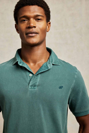 Classic cotton pique garment dyed emerald green men’s polo shirt washed for a soft touch. 100% cotton. With a subtle faded wash. Casual wear. Machine wash. Size S, M, L, XL, XXL.