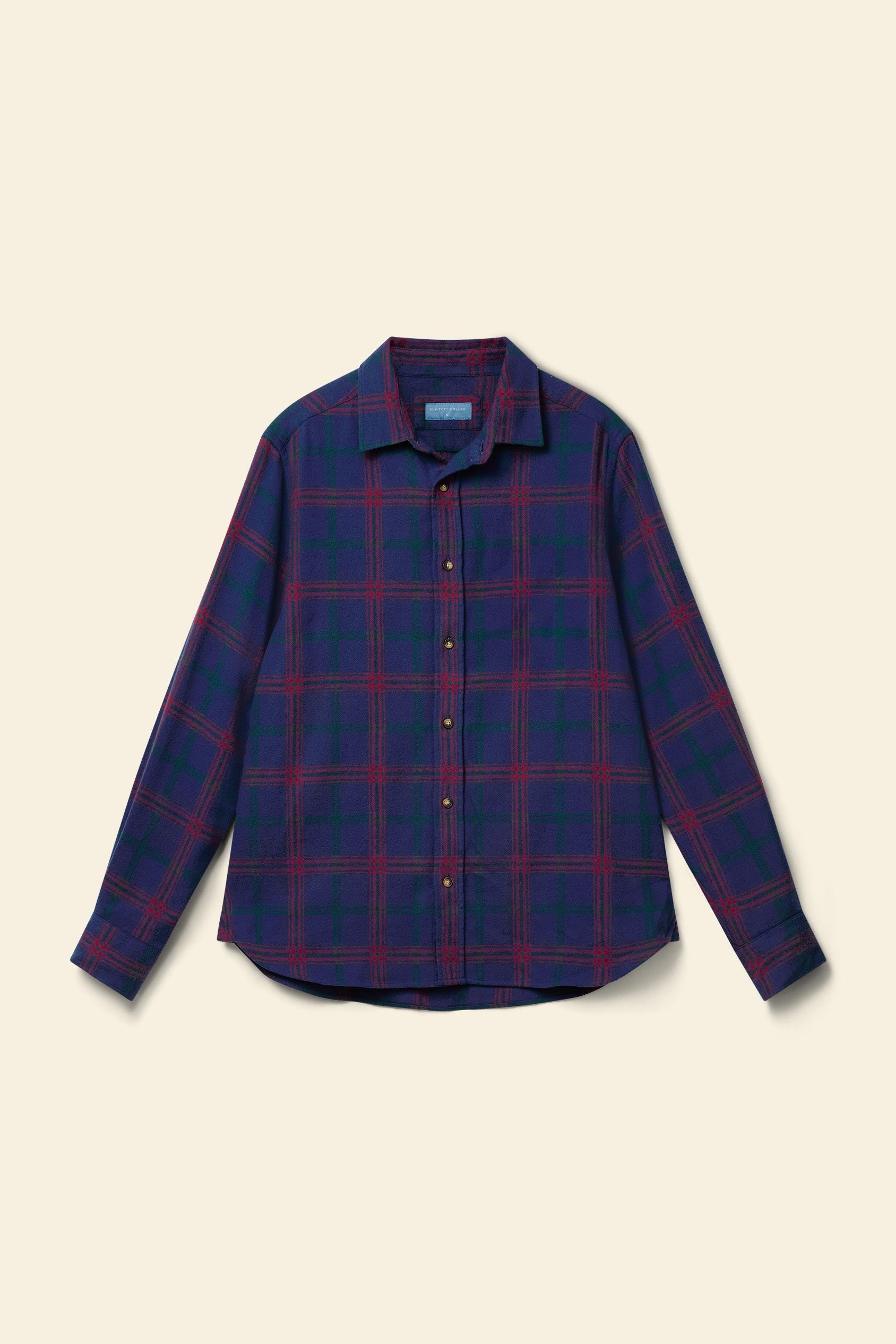 Blue and red plaid shirt on a beige background