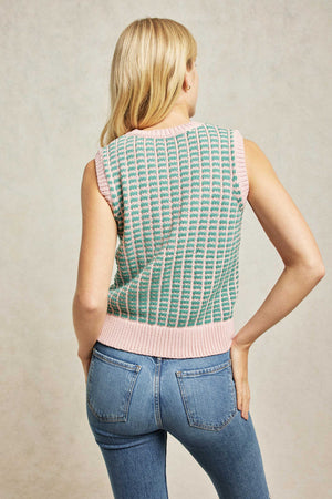 Crew neck women’s vest with knitted grid design in pink and green. Knitted with a striking grid motif. It's woven to a fuss-free, crew-neck silhouette with pink trim. Casual wear. Size XS, S, M, L, XL. Machine Wash.