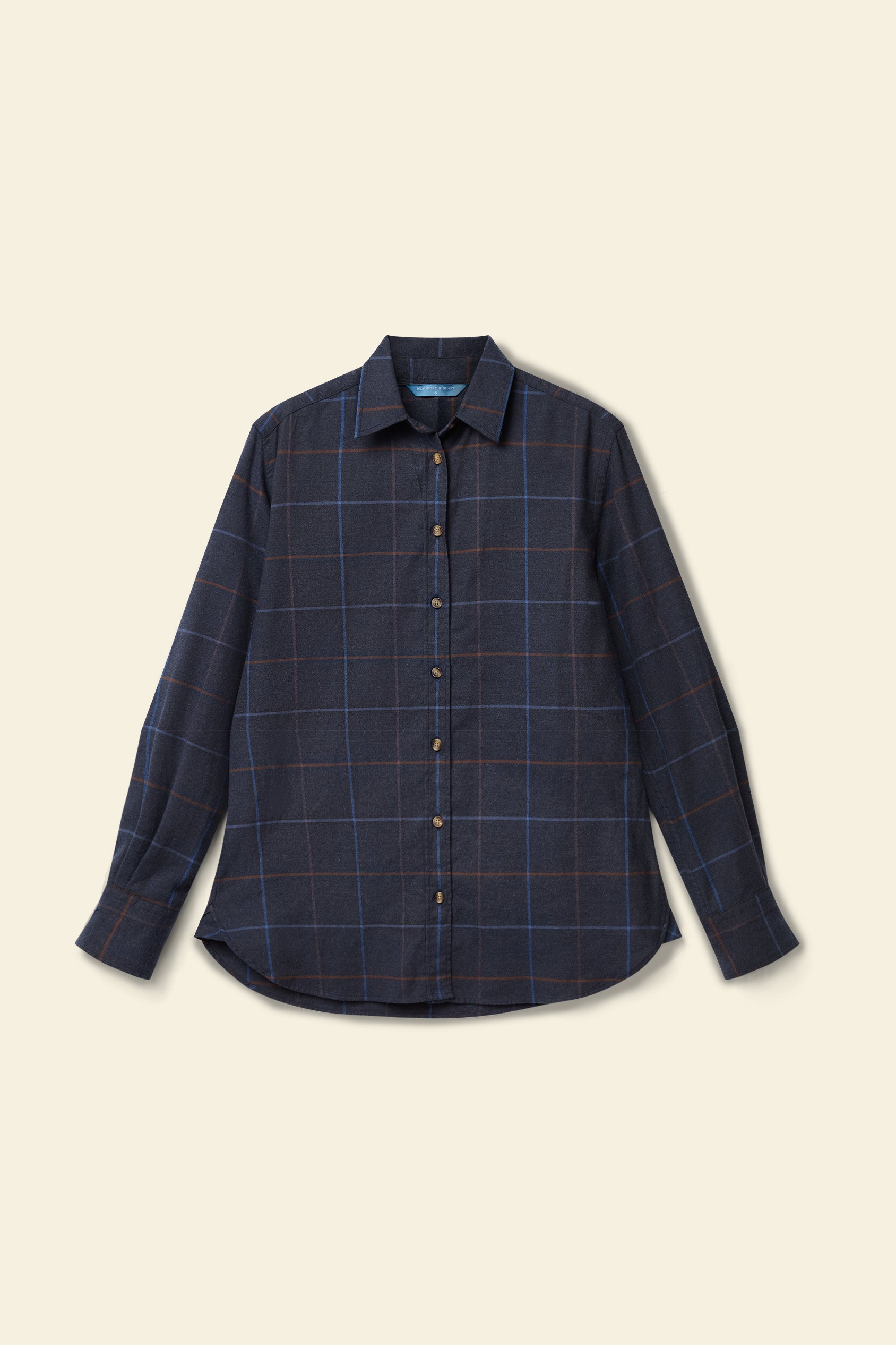 Blue plaid shirt on a beige background