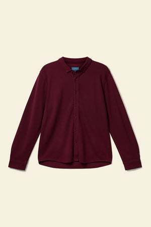 Maroon shirt on a beige background