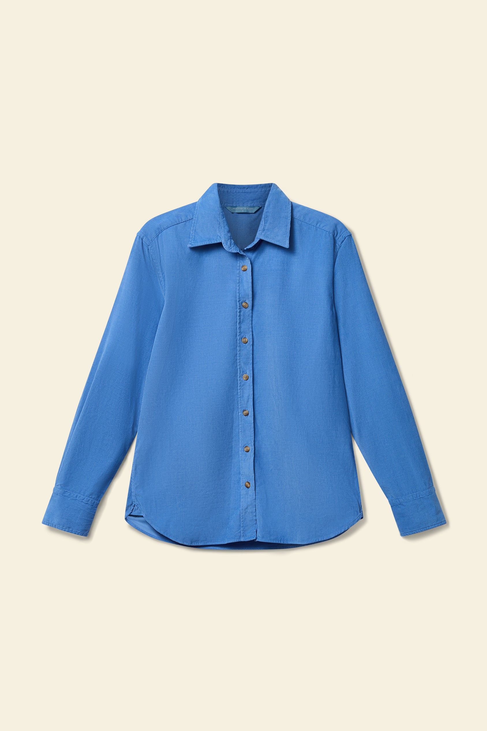 Blue shirt on a beige background
