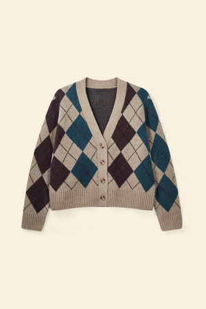 Argyle patterned cardigan on a beige background
