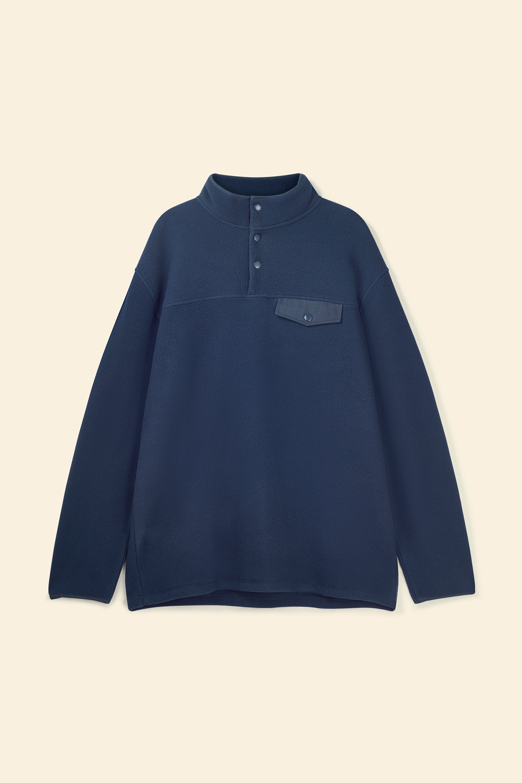 Navy blue pullover with a pocket on a beige background