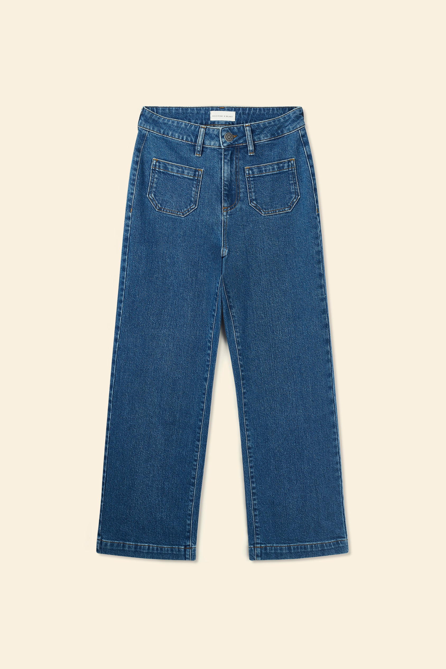 Blue jeans on a beige background