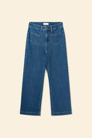 Blue jeans on a beige background
