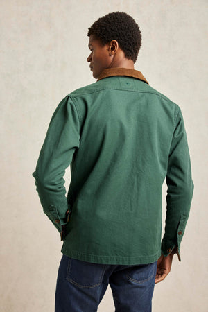 Men’s Barn Coat cut from hardy green khaki cotton canvas with a quilted lining. 100% Cotton Canvas. Corduroy detailing adds vintage appeal. Outdoor, chore coat, warm and light casual wear, good for layering. Size S,M,L,XL,XXL.