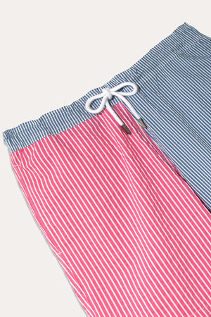 Men’s mesh lined seersucker colour block pink and blue stripe swim shorts. Elasticated drawstring waist with side pockets and back pocket. Swim and beach wear. Made in Portugal. Machine wash. Size S,M,L,XXL.