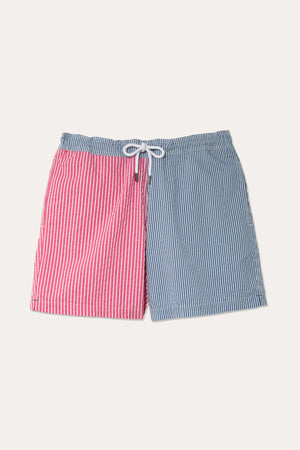 Men’s mesh lined seersucker colour block pink and blue stripe swim shorts. Elasticated drawstring waist with side pockets and back pocket. Swim and beach wear. Made in Portugal. Machine wash. Size S,M,L,XXL.
