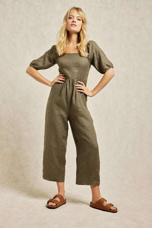 Linen jumpsuit with gathers at waist and slanted front pockets. It's cut from breathable linen to an effortless fit with puff sleeves and an elasticated back panel for added comfort. Casual wear. Size 6,8,10,12,14,16,18. Summer jumpsuit. Machine wash.