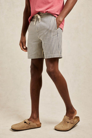 Drawstring ecru white men’s ticking stripe shorts with side and back pockets. Your favourite drawstring shorts, cut from stretch cotton with a vintage ticking stripe. Casual wear. Machine wash. Size 30,32,34,36,38.
