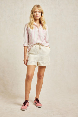 Classic collar women’s pink stripe shirt, boyfriend fit with back box pleat and curved hem. Classic collar, pastel stripes, and elephant embroidery on the cuff. Woven from soft blend of organic cotton. Casual wear. Size XS, S, M, L, XL. Made in Portugal. Machine wash.