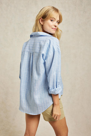 Linen pop over top with cut away collar and breast pocket. A pared-back take on our favourite linen shirts, cut to a popover fit and patterned with subtle stripes. Boyfriend fit. Casual wear. Size XS, S, M, L, XL. Made in Portugal. Machine wash.