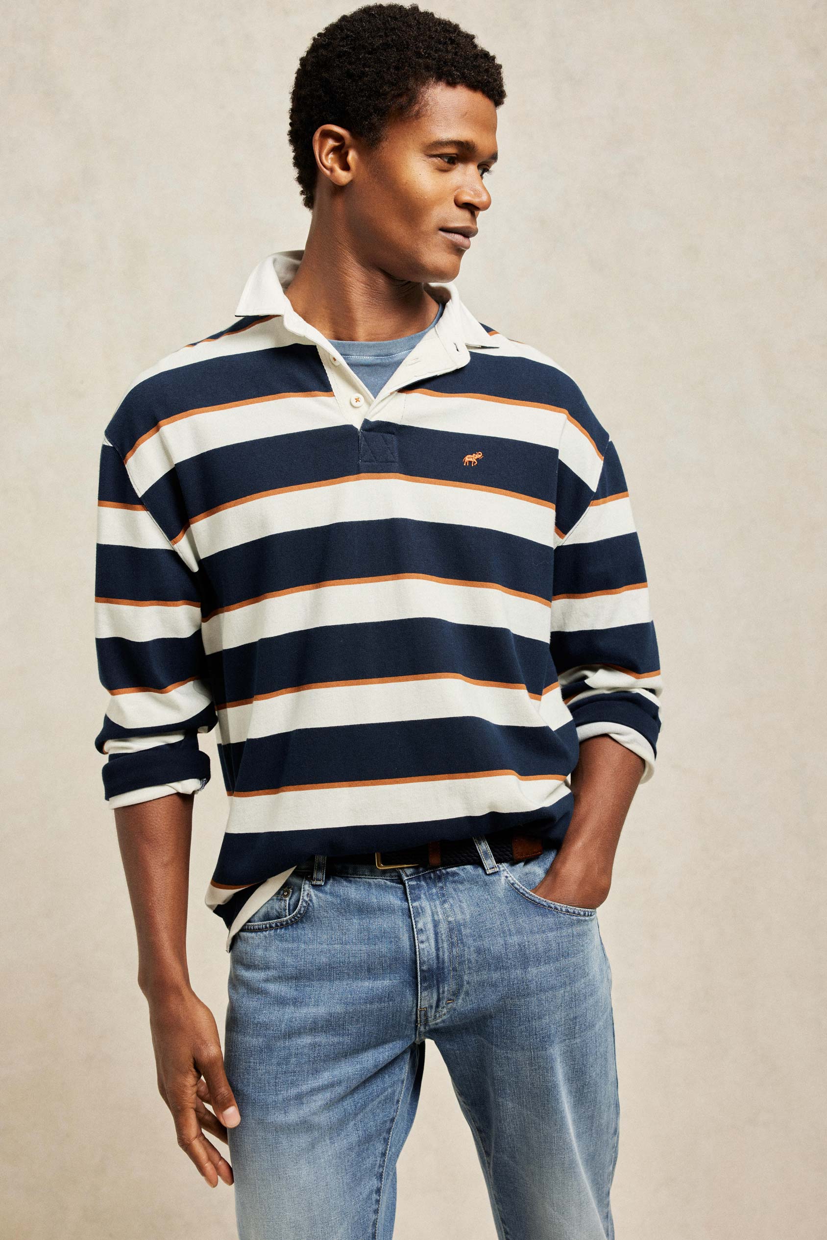 Yarn dyed men’s navy blue and white stripe rugby shirt with a vintage classic collar and soft peached finish. 100% Cotton. Casual wear. Machine wash. Size S, M, L, XL, XXL.