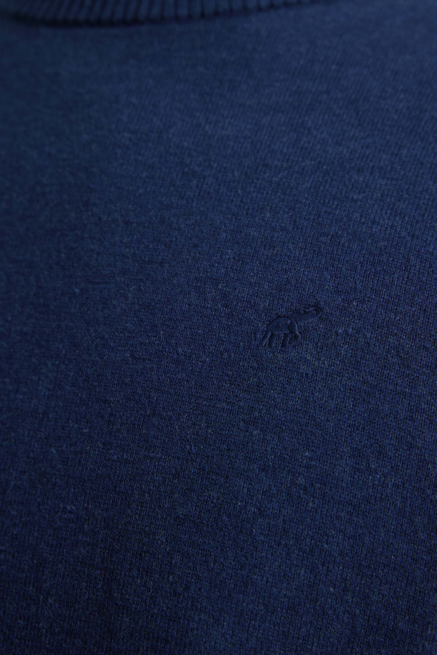 Navy blue fabric with a small logo in the center