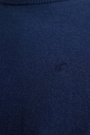 Navy blue fabric with a small logo in the center