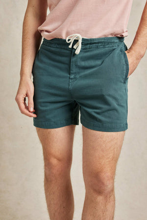 Drawstring men’s rugby shorts, garment dyed emerald green for a vintage look. Cut from cotton to an old-school rugby design with a drawstring waist. Casual wear. Machine wash. Size 30,32,34,36,38.