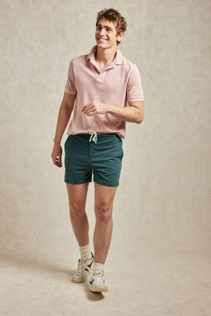 Drawstring men’s rugby shorts, garment dyed emerald green for a vintage look. Cut from cotton to an old-school rugby design with a drawstring waist. Casual wear. Machine wash. Size 30,32,34,36,38.