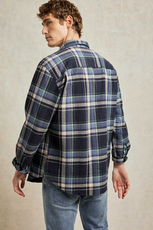 Seersucker men’s check shirt with button chest pockets. Woven from cotton with a breathable crimped texture, seersucker is a fabric choice for summer. Casual wear. Made in Portugal. Machine wash. Size S, M, L, XL, XXL.Seersucker men’s check shirt with button chest pockets. Woven from cotton with a breathable crimped texture, seersucker is a fabric choice for summer. Casual wear. Made in Portugal. Machine wash. Size S, M, L, XL, XXL.