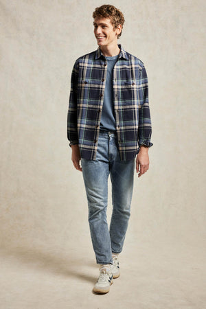 Seersucker men’s check shirt with button chest pockets. Woven from cotton with a breathable crimped texture, seersucker is a fabric choice for summer. Casual wear. Made in Portugal. Machine wash. Size S, M, L, XL, XXL.