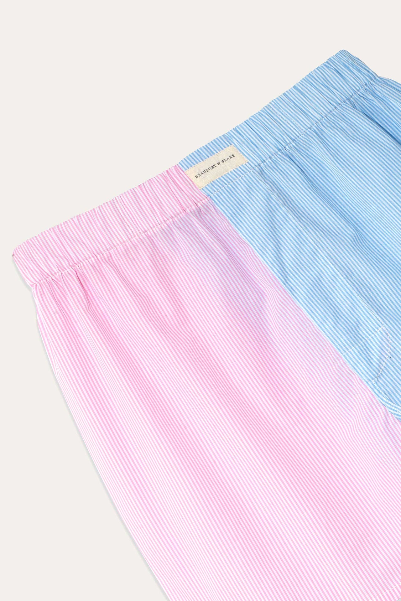 Fine stripe pink and blue colour block poplin boxers. Elasticated waistband and extra rear seat panel for added comfort. Made in Portugal. Machine Wash. Underwear. Size S, M, L, XL, XXL.