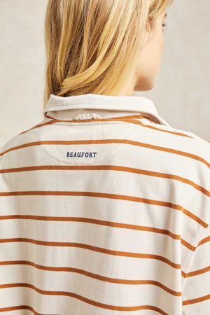 The Honeysuckle women’s rugby is patterned with pecan-brown stripes and cut with a subtly cropped hem. Stripe cotton rugby with super soft feel fabric with a twill collar and rubberised buttons. Casual wear. Size XS, S, M, L, XL. Machine wash.
