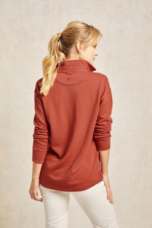 The Kittisford is a trusty staple, cut from cotton with a subtle faded wash. Loopback women’s maple red orange sweatshirt in classic rugby style, garment dyed for vintage look. A soft, vintage-inspired sweat. Casual wear. Size XS, S, M, L, XL. Machine wash.