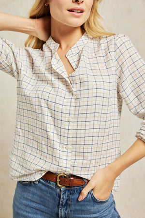 A twist on the Tattersall, this shirt balances authentic checks with an elegant Nehru collar. Cut from a soft linen-cotton blend and detailed with subtle gathering across the shoulders. Boyfriend fit. Casual wear. Size XS, S, M, L, XL. Made in Portugal. Machine wash.