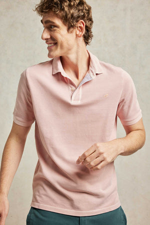 Classic cotton pique garment dyed men’s pink polo shirt washed for a soft touch. 100% cotton. With a subtle faded wash. Casual wear. Machine wash. Size S, M, L, XL, XXL.