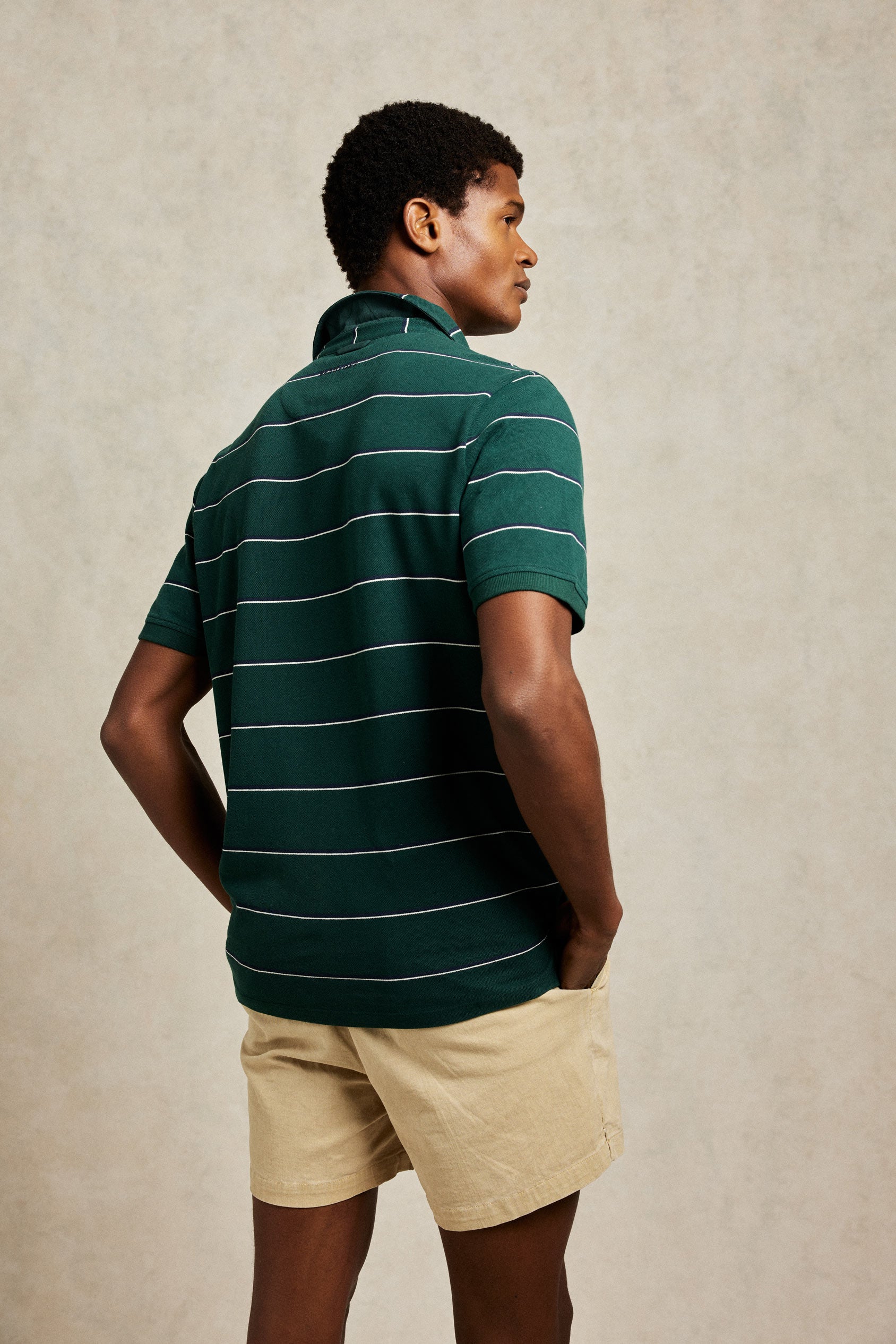 Emerald green stripe pique men’s polo shirt washed for a soft touch. 100% Cotton. Cut from pique cotton to a classic fit and patterned with stripes. Casual wear. Machine wash. Size S, M, L, XL, XXL.