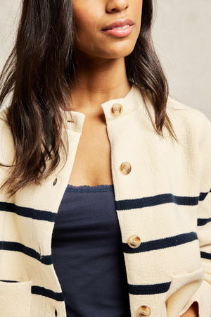 Knitted women’s jacket with navy stripe design and front pockets. Knitted from 100% cotton to a collarless silhouette and patterned with navy stripes. Casual wear. Size XS, S, M, L, XL. Machine Wash.