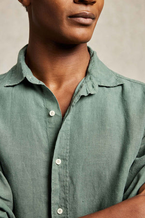 Linen garment dyed khaki men’s green shirt with classic collar. 100% Linen. Cut from soft linen to an immaculate fit with a classic collar. Casual wear. Made in Portugal. Machine wash. Size S, M, L, XL, XXL.