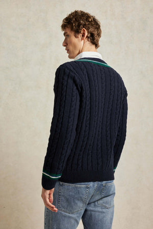 Vintage design cable knit navy blue cricket jumper with contrast green tipping at V-neck and cuffs. Woven from 100% Italian Lambswool. Made in Portugal. Casual wear. Size S, M, L, XL, XXL.