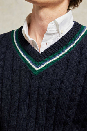 Vintage design cable knit navy blue cricket jumper with contrast green tipping at V-neck and cuffs. Woven from 100% Italian Lambswool. Made in Portugal. Casual wear. Size S, M, L, XL, XXL.